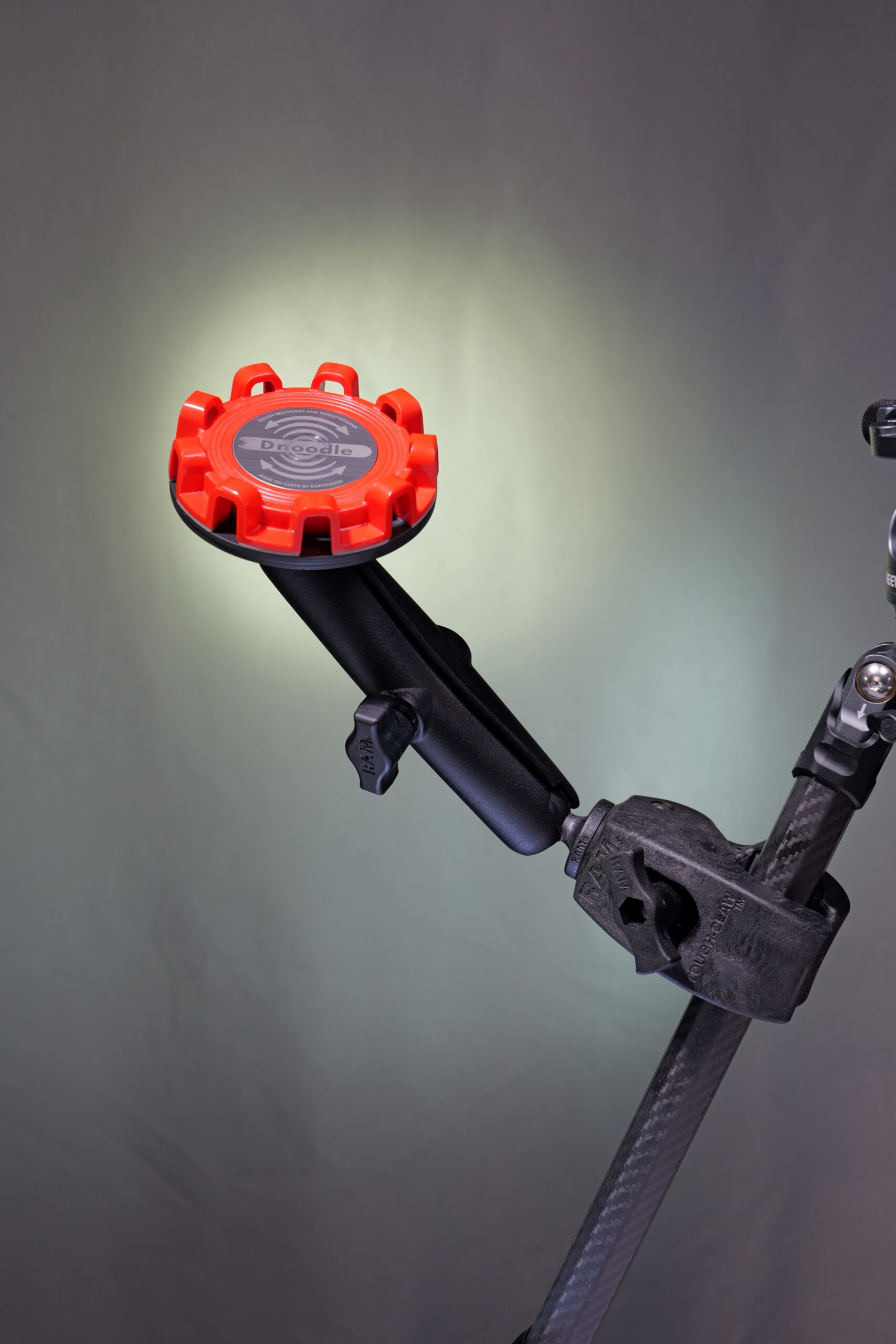 Dnoodle TwistLatch Tough Claw magnetic mount securely hold a device or drinkware to rails or handlebars.